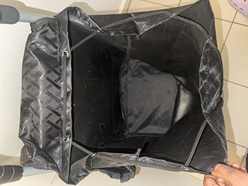 Black personal shopping trolley opened to show inside